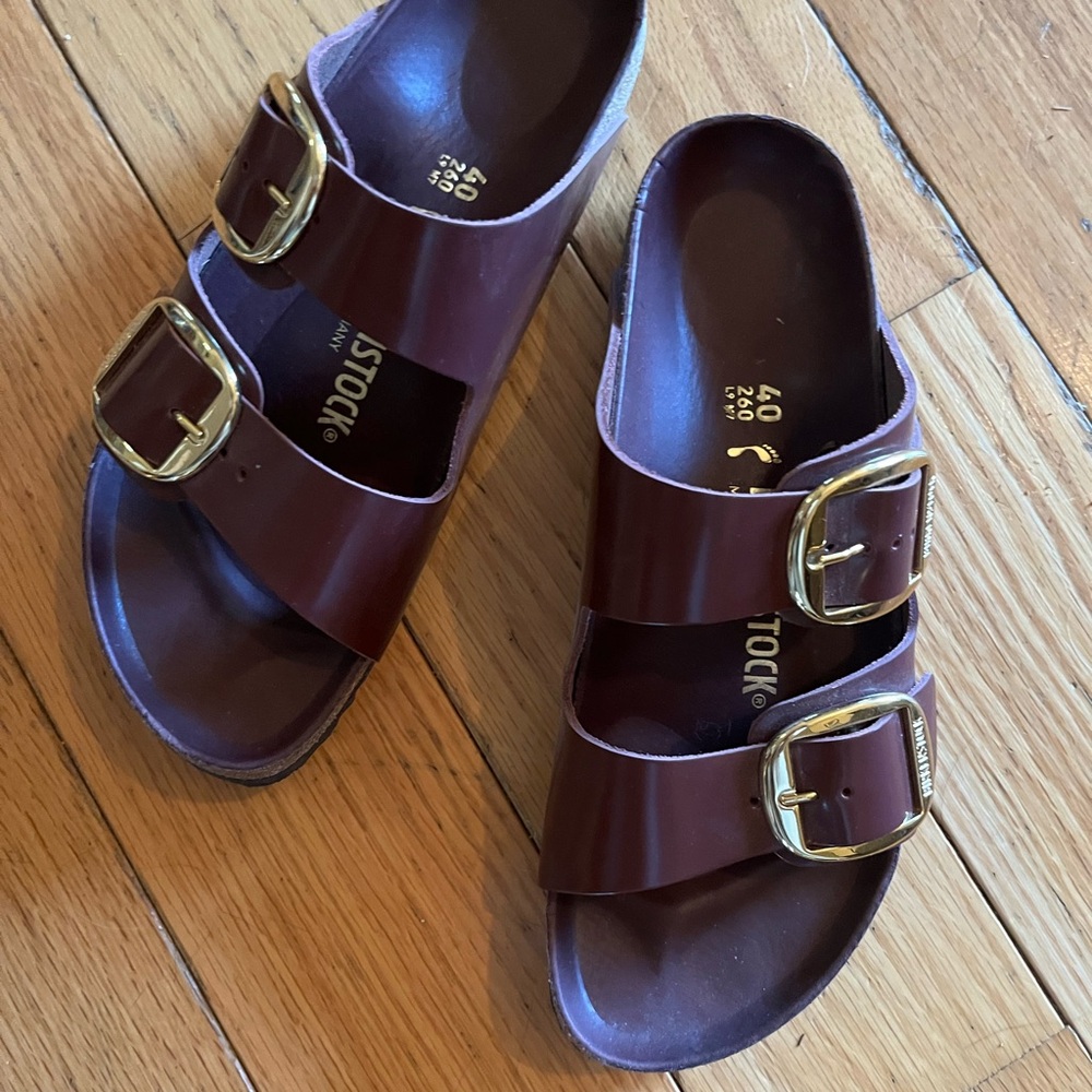 Birkenstock Arizona Two-Strap Sandals in Brown/Burgundy Patent with Gold Buckles